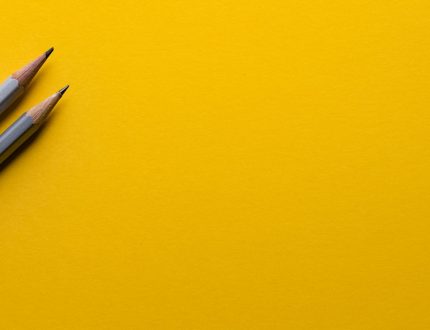 pencils against yellow background